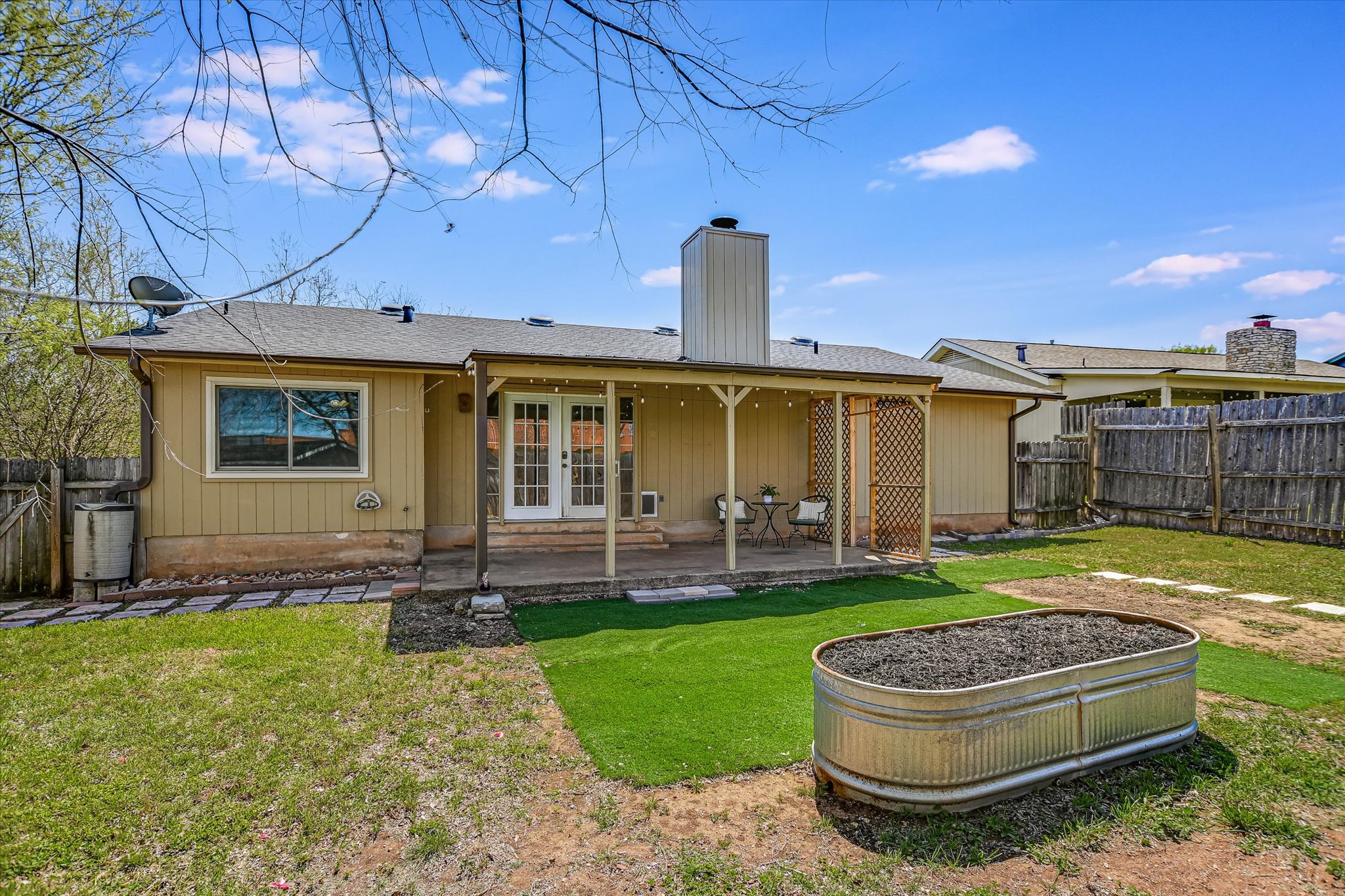 606 Splitrock Round Rock, TX 78681 - Photo 17 of 18 a front view of a house with a garden and yard