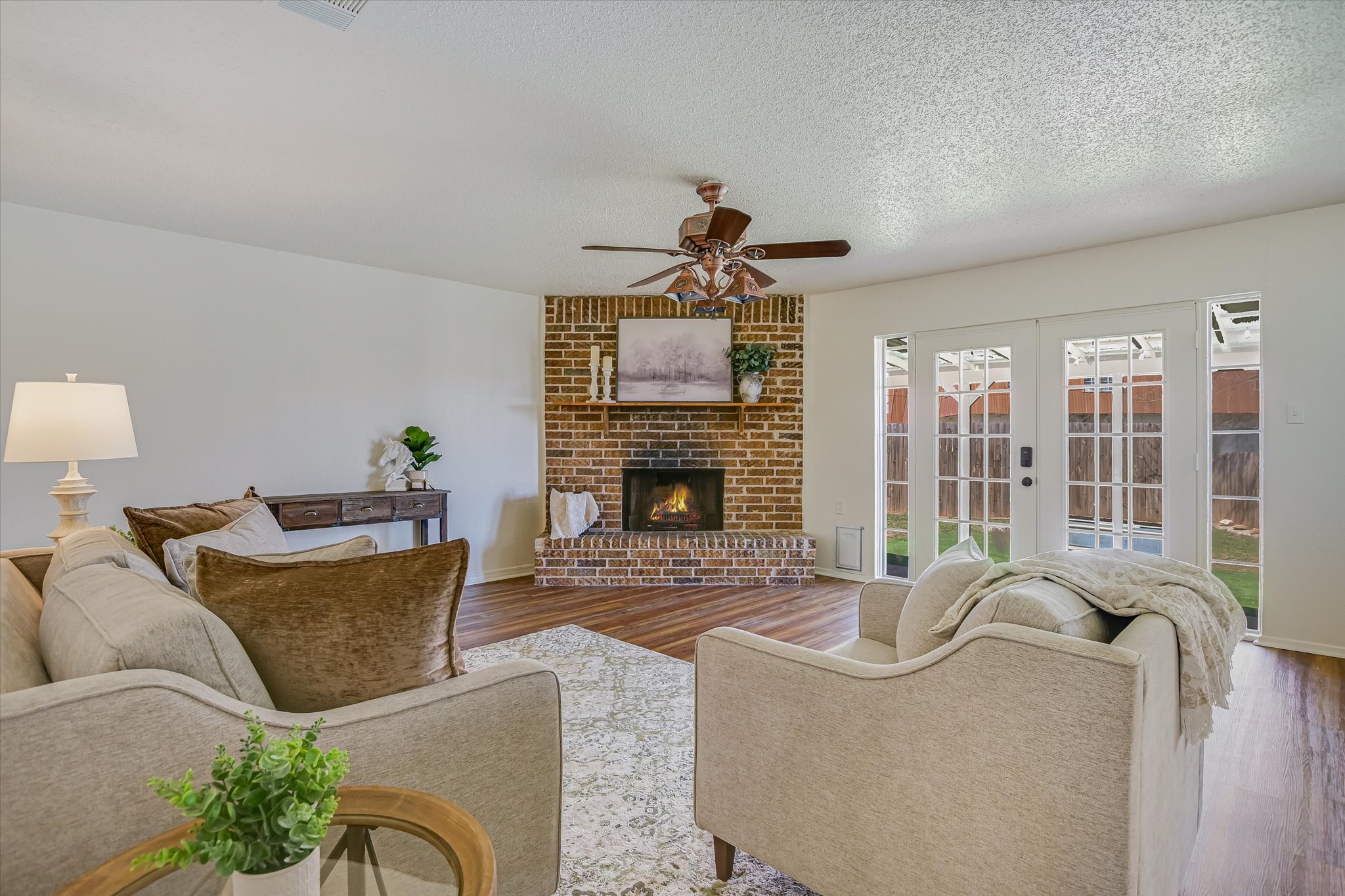 606 Splitrock Round Rock, TX 78681 - Photo 3 of 18 a living room with furniture a fireplace and a flat screen tv
