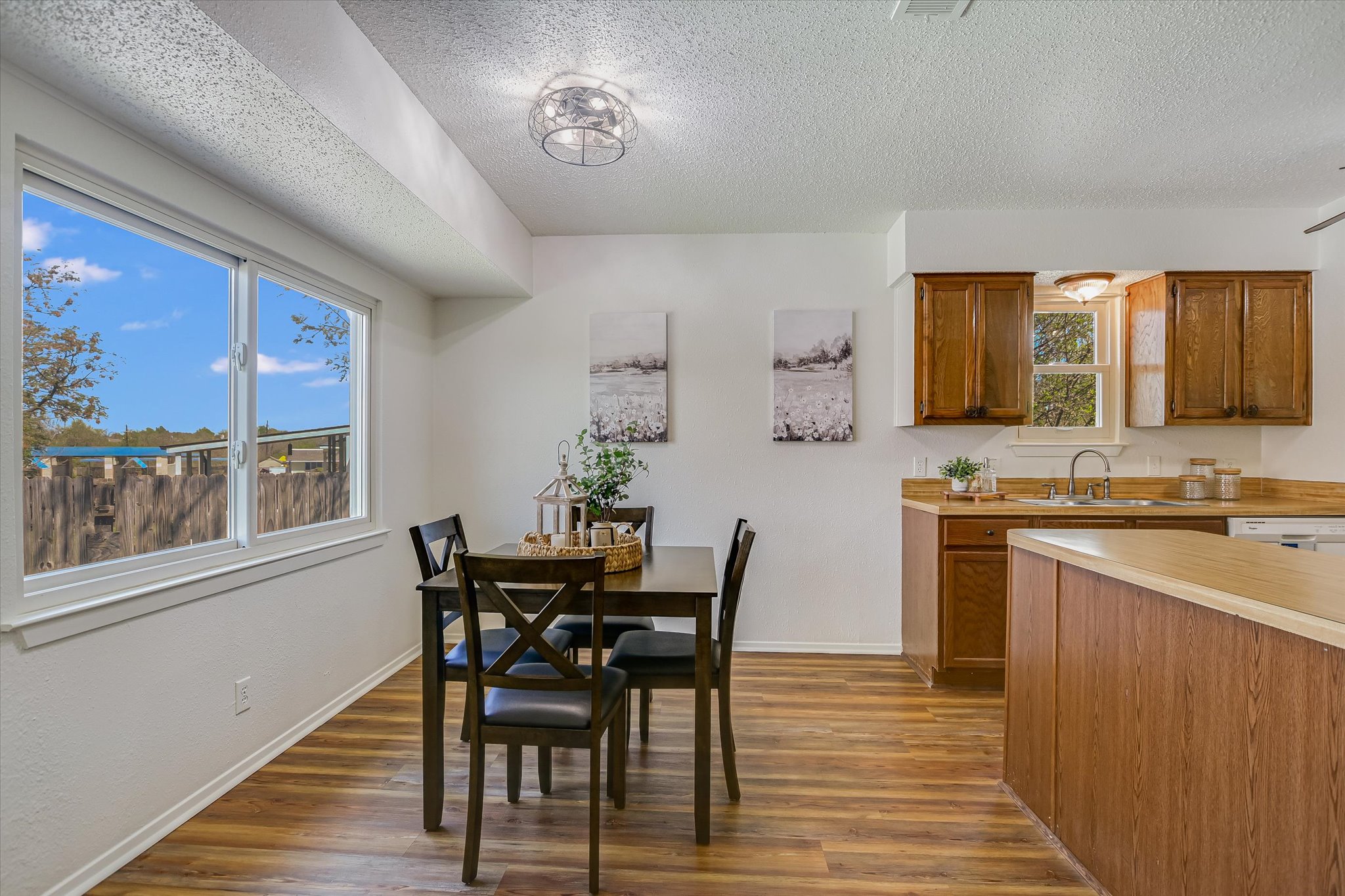 606 Splitrock Round Rock, TX 78681 - Photo 4 of 18 a view of a dining room with furniture and wooden floor