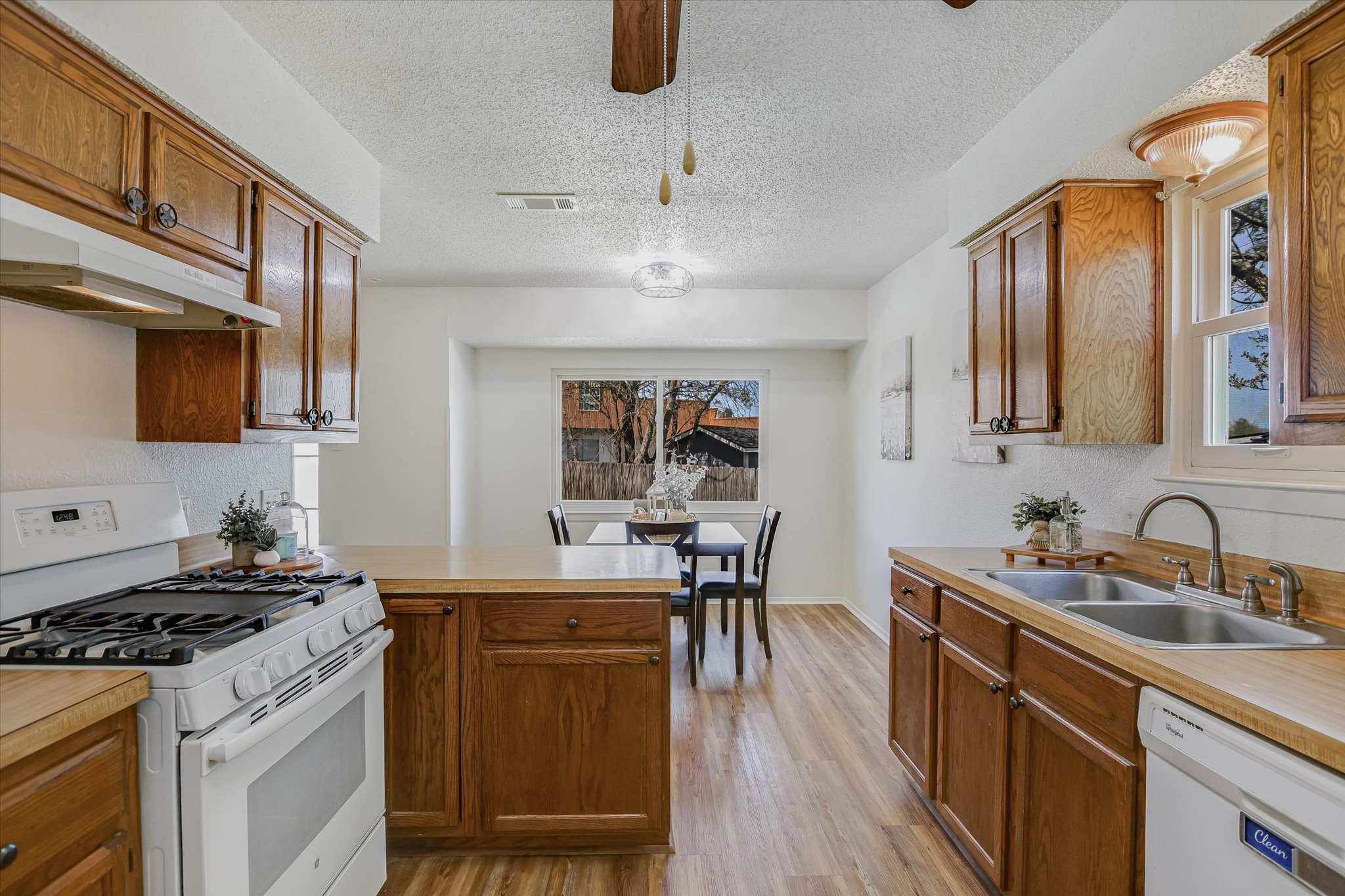 606 Splitrock Round Rock, TX 78681 - Photo 6 of 18 a kitchen with a sink stove and cabinets
