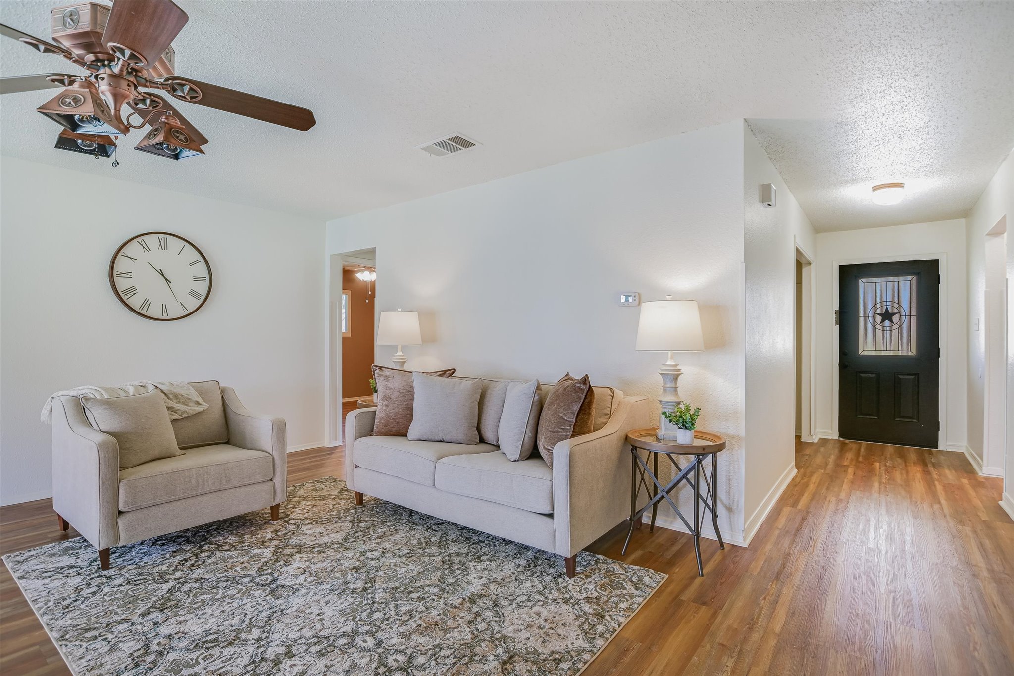 606 Splitrock Round Rock, TX 78681 - Photo 9 of 18 a living room with furniture and a wooden floor