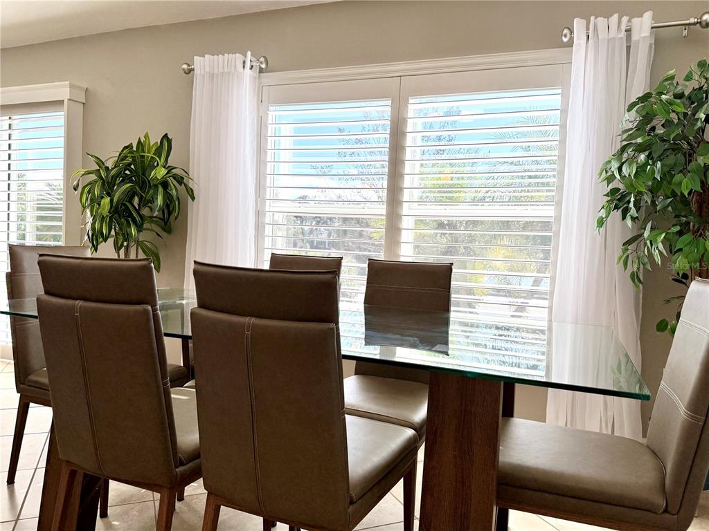 3088 Berwyn Way The Villages, FL 32162 - Photo 13 of 60 a view of a dining room with furniture and a potted plant