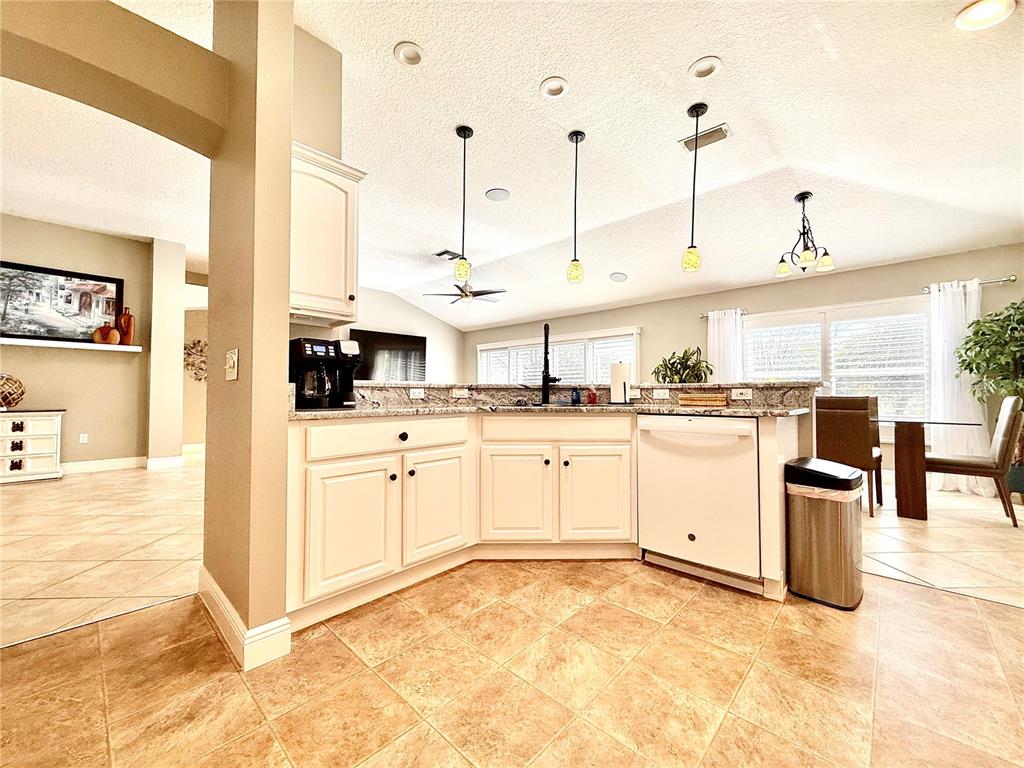 3088 Berwyn Way The Villages, FL 32162 - Photo 17 of 60 a kitchen with cabinets and chairs