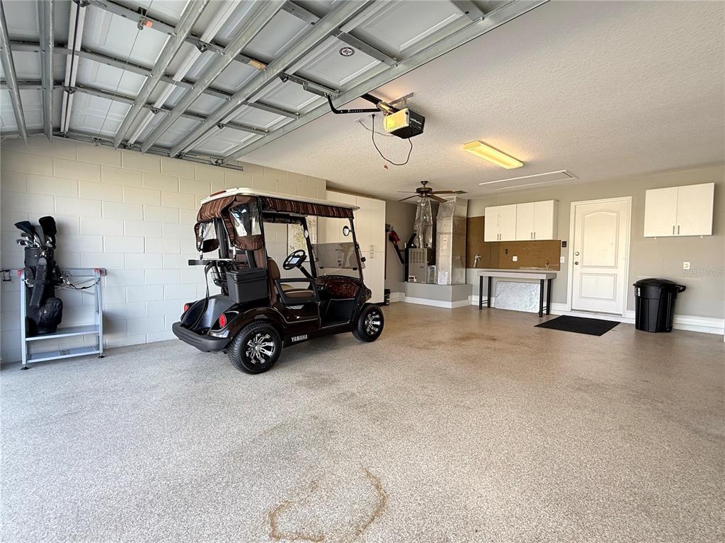 3088 Berwyn Way The Villages, FL 32162 - Photo 22 of 60 a view of a garage with furniture