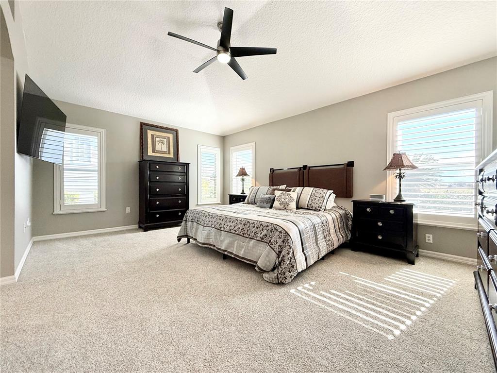 3088 Berwyn Way The Villages, FL 32162 - Photo 25 of 60 a bedroom with a bed dresser and a window