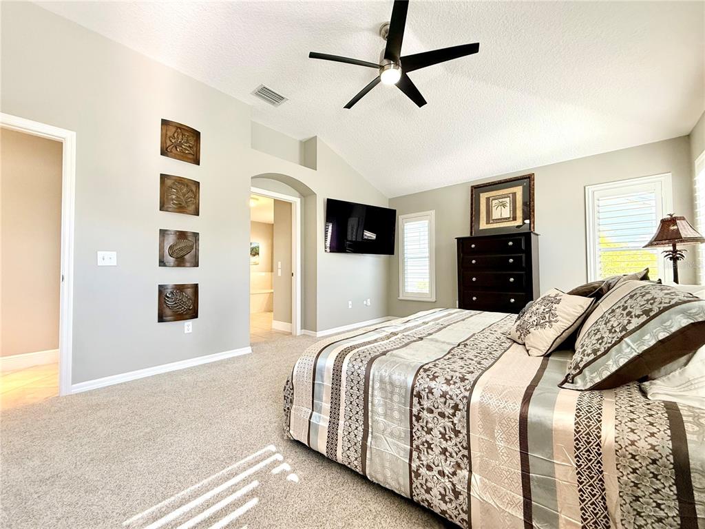 3088 Berwyn Way The Villages, FL 32162 - Photo 27 of 60 a bedroom with a bed and dresser