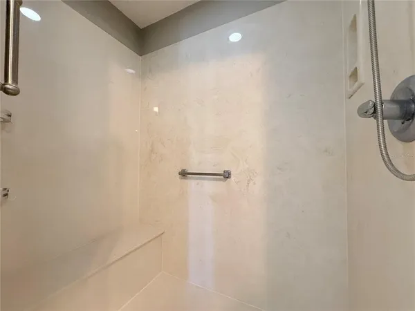 a view of a swimming pool with an outdoor seating