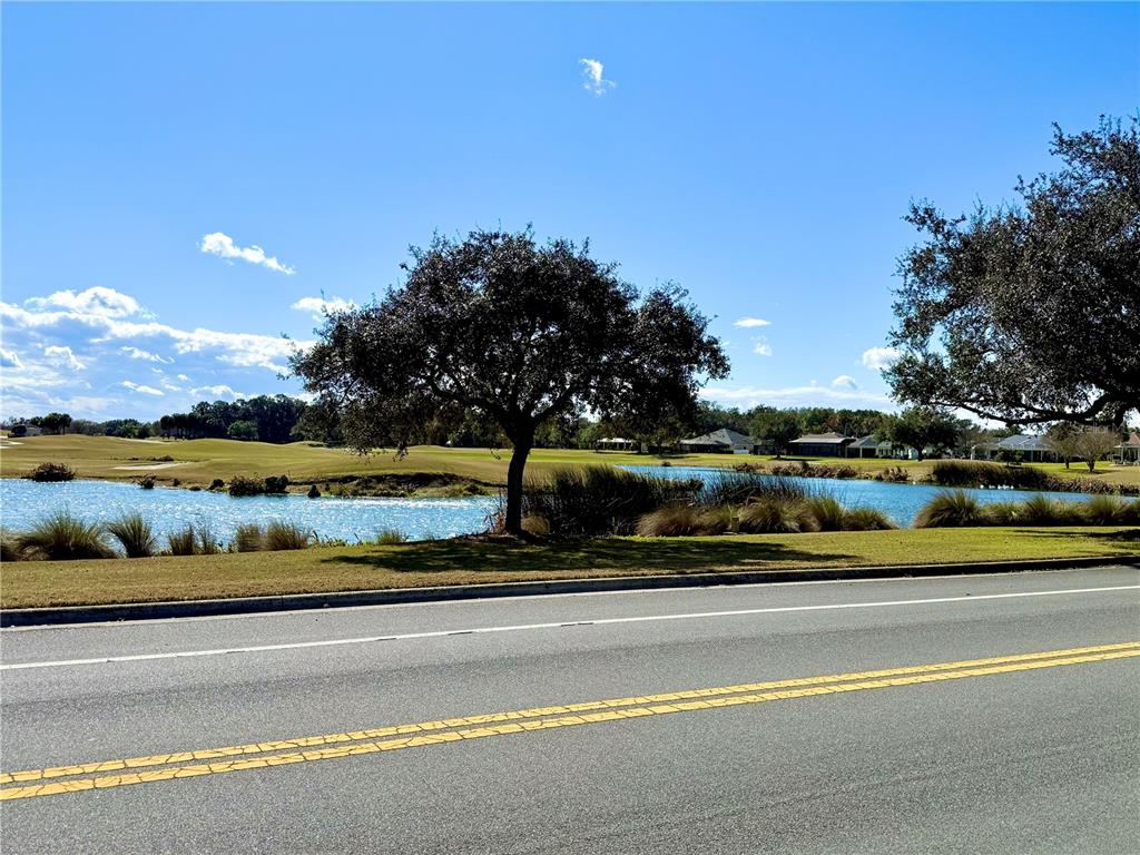 3088 Berwyn Way The Villages, FL 32162 - Photo 38 of 60 a view of a swimming pool with an outdoor seating
