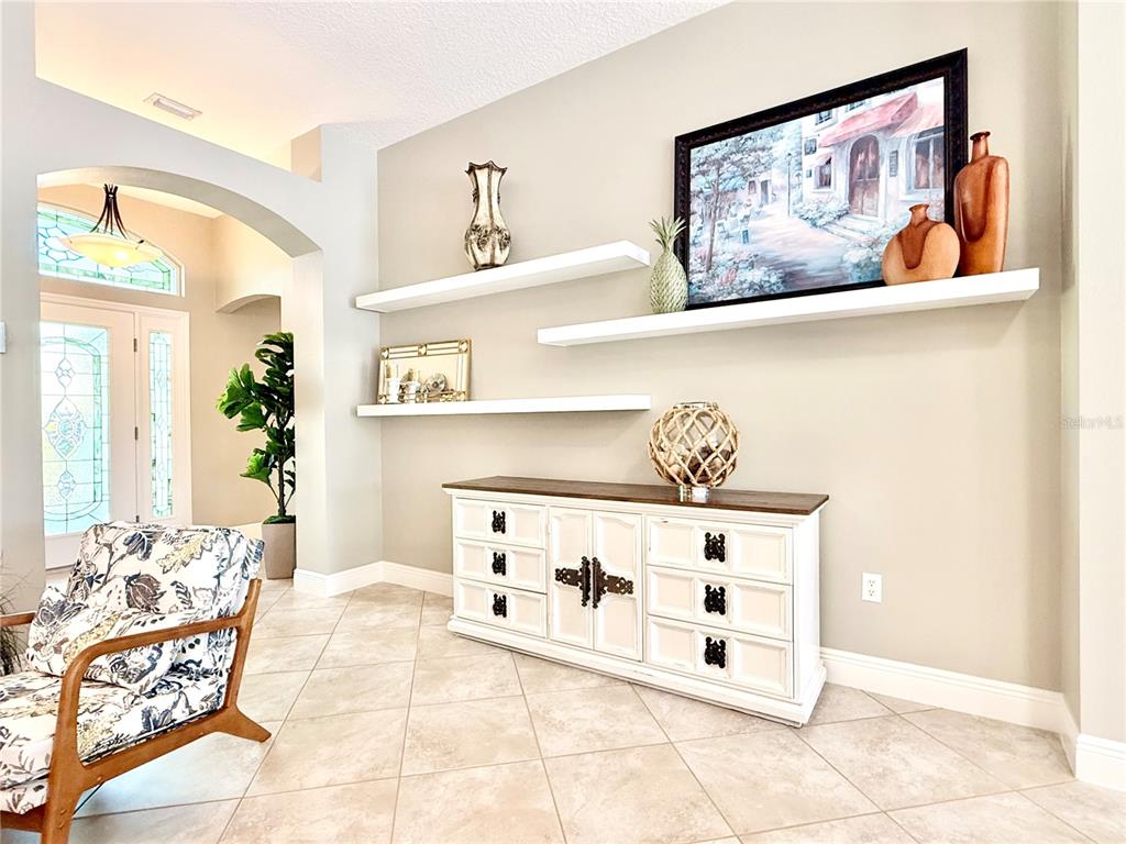 3088 Berwyn Way The Villages, FL 32162 - Photo 9 of 60 a spacious bedroom with a bed and a painting on the wall