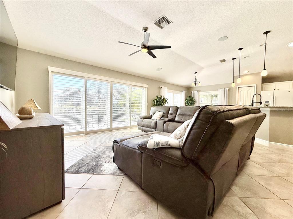 3088 Berwyn Way The Villages, FL 32162 - Photo 10 of 60 a living room with furniture and a large window
