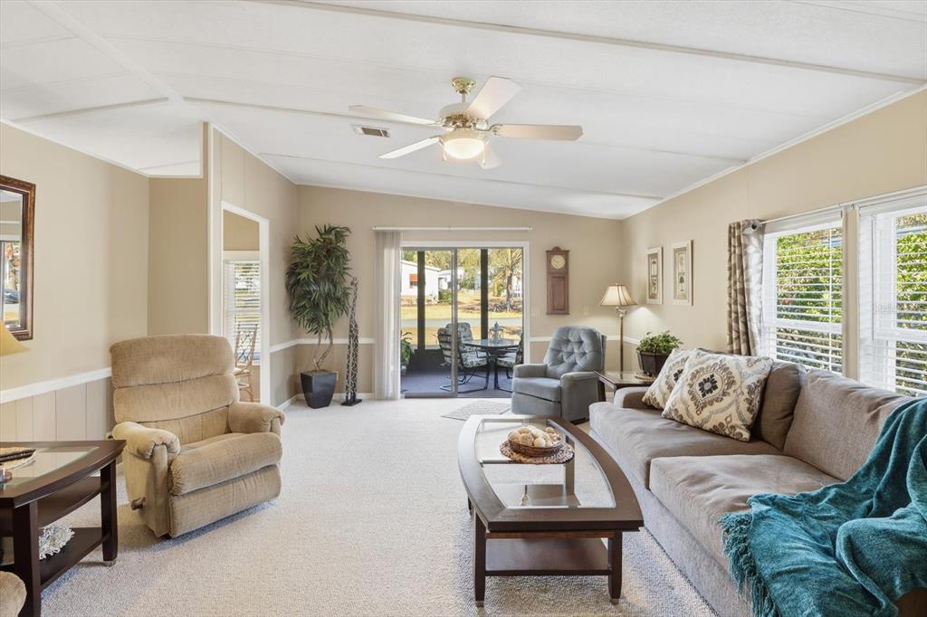 2285 North Loma Point Hernando, FL 34442 - Photo 13 of 36 a living room with furniture and a large window
