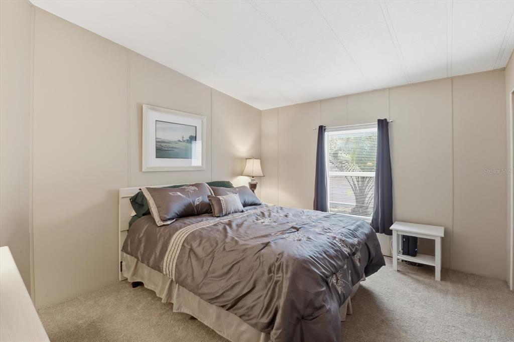 2285 North Loma Point Hernando, FL 34442 - Photo 21 of 36 a bedroom with a bed and a lamp
