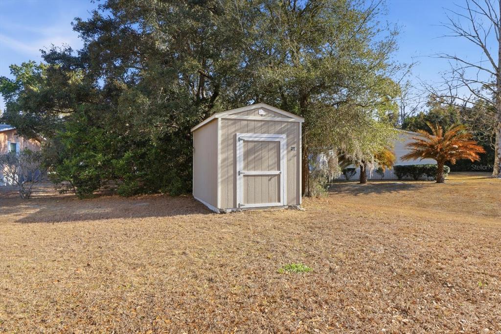 2285 North Loma Point Hernando, FL 34442 - Photo 32 of 36 a front view of a house with a yard
