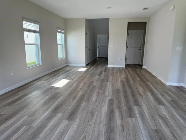 a bathroom with a granite countertop shower a toilet and a sink