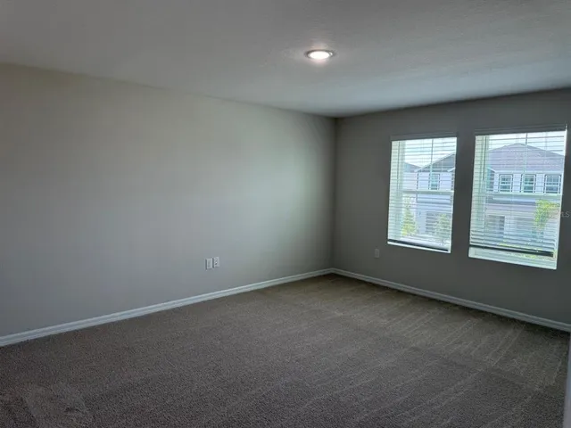a bathroom with a shower sink vanity and mirror