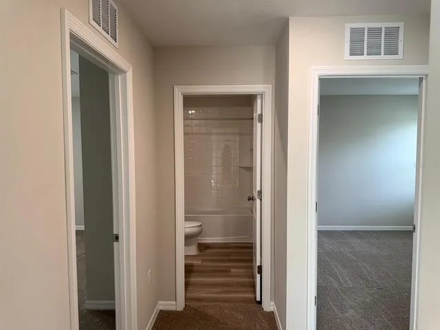 a view of an empty room with a window