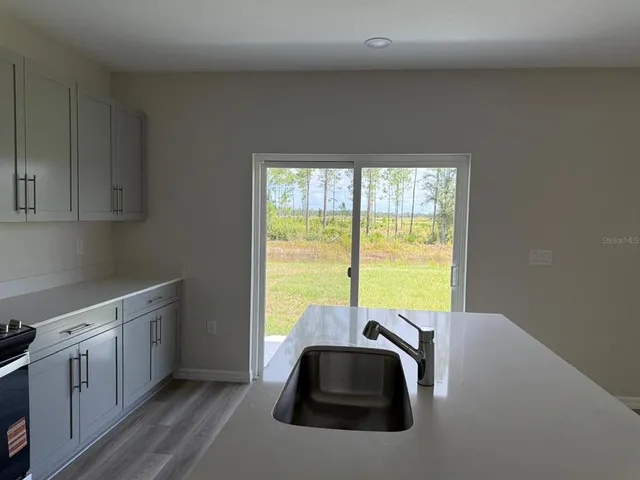 a room with a bed and a window