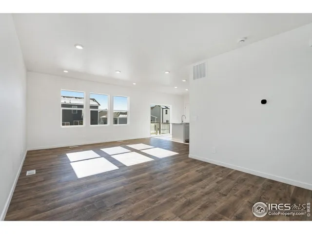 a view interior of kitchen and hall with wooden floor