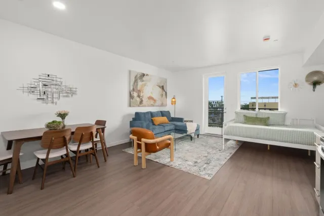 a kitchen with a sink cabinets and wooden floor
