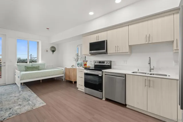 a view of a hallway with washer and dryer