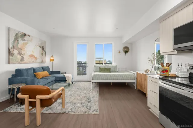 a bedroom with furniture and a wooden floor