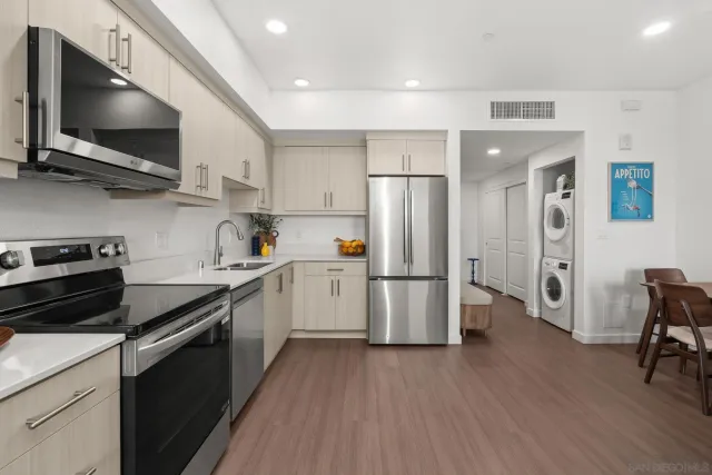a kitchen with a refrigerator stove and microwave