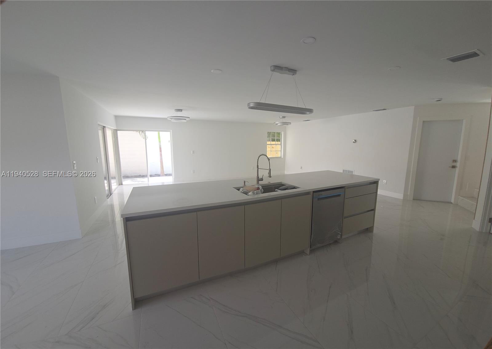 13911 Southwest 100th Lane Miami, FL 33186 - Photo 11 of 55 a room with a sink cabinets and window