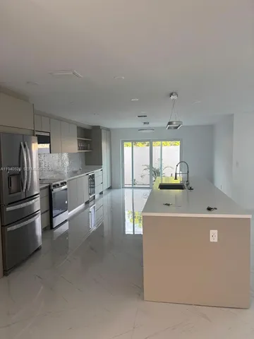 a view of a refrigerator in a kitchen