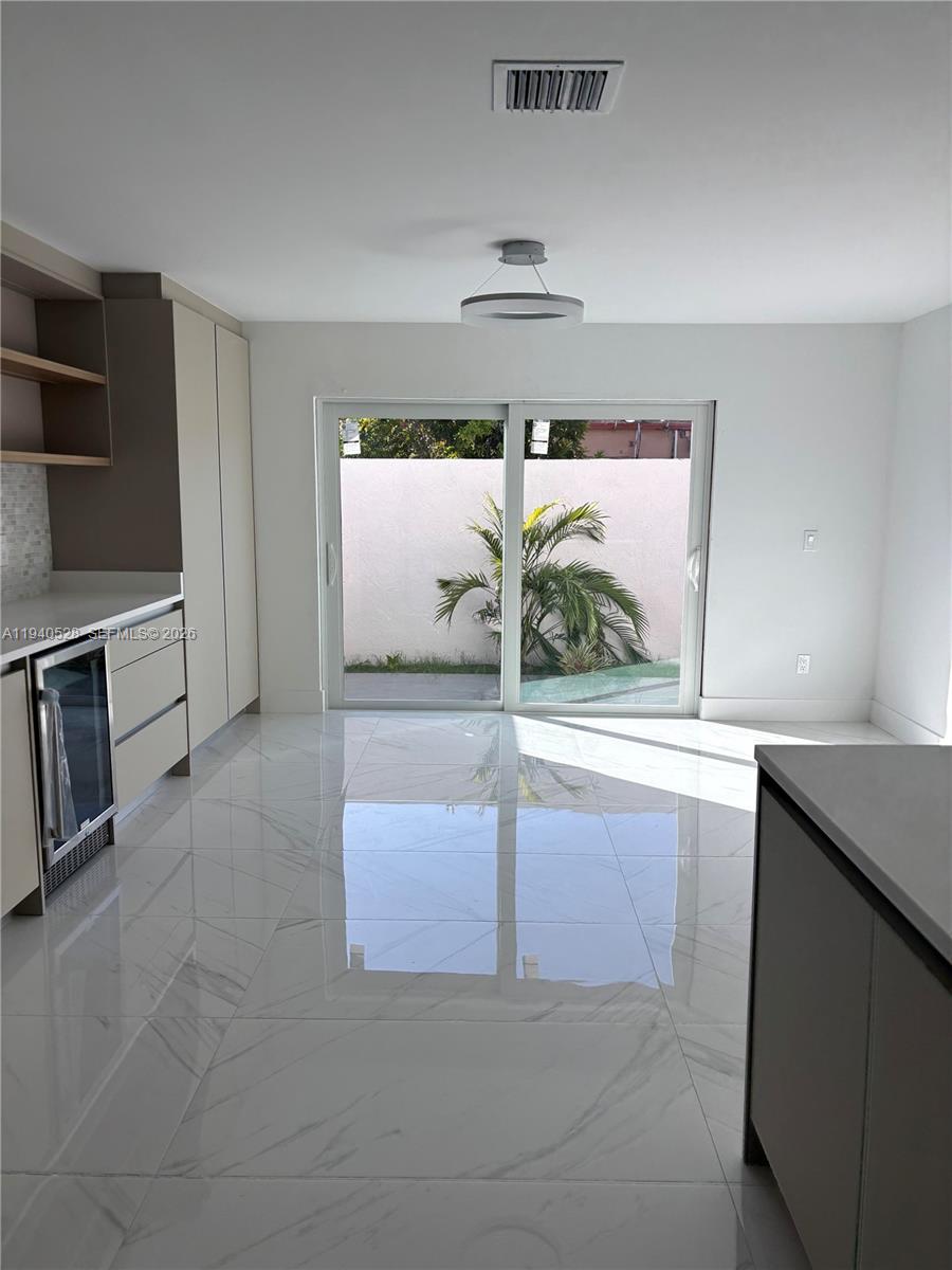 13911 Southwest 100th Lane Miami, FL 33186 - Photo 19 of 55 a view of a kitchen with a sink and dishwasher cabinets