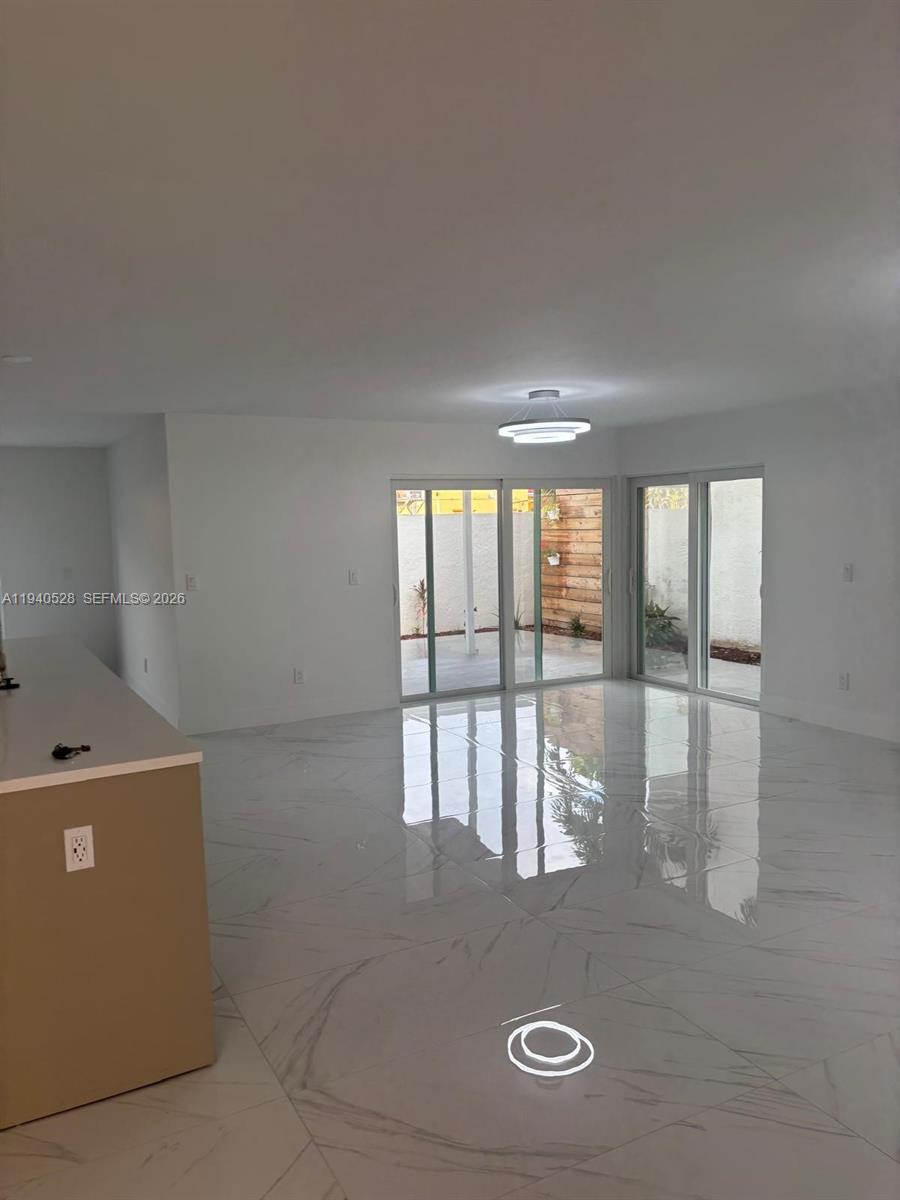 13911 Southwest 100th Lane Miami, FL 33186 - Photo 24 of 55 a view of water heater room with wooden floor