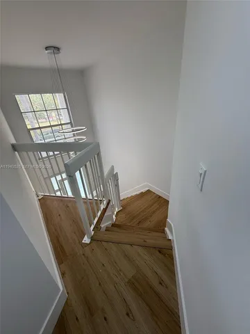 a spacious bathroom with a double vanity sink and mirror