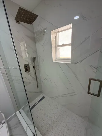 a view of a potted plant in front of a window