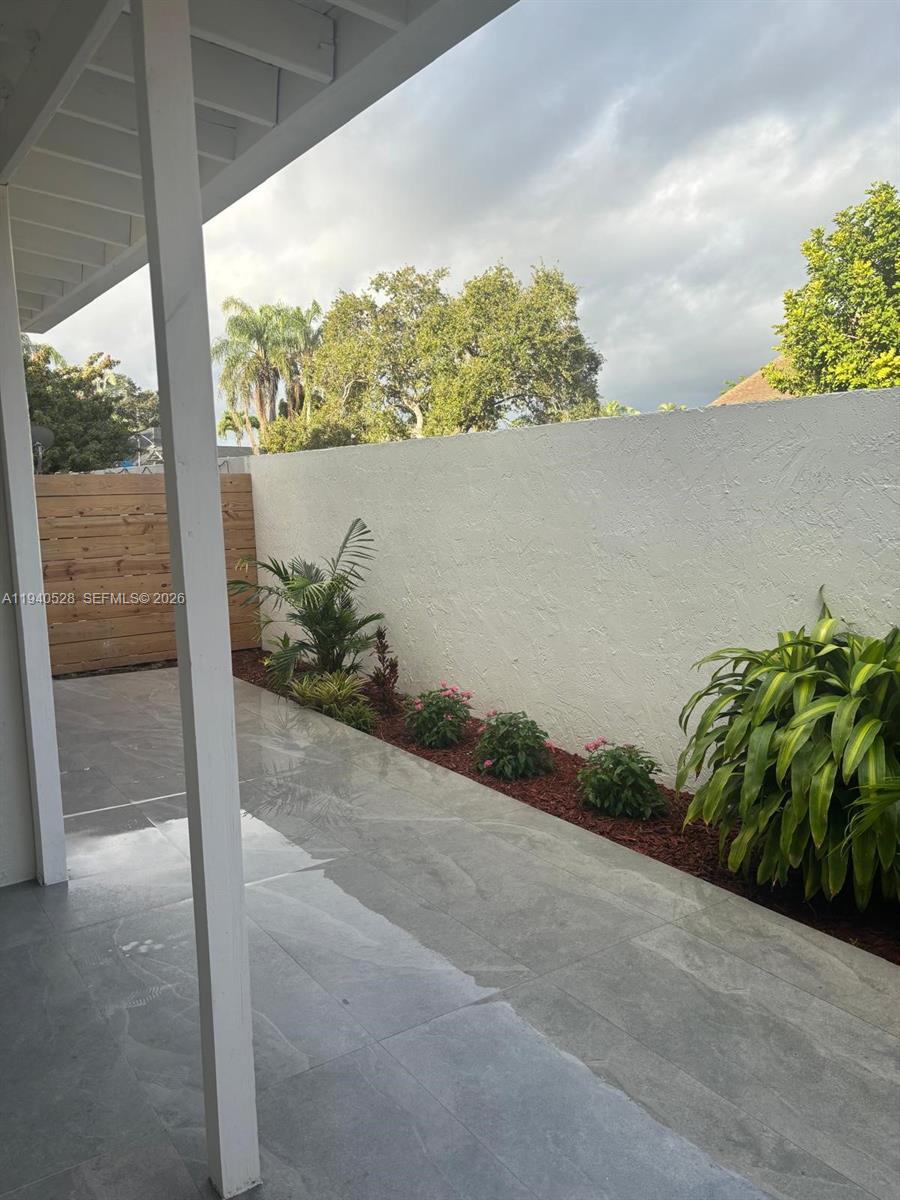 13911 Southwest 100th Lane Miami, FL 33186 - Photo 46 of 55 a view of a potted plant in front of a window