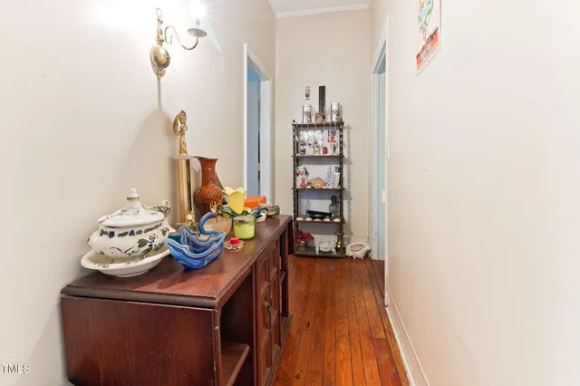 a kitchen with a dining table chairs and white cabinets