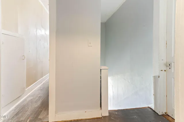 a living room with furniture a dining table and wooden floor
