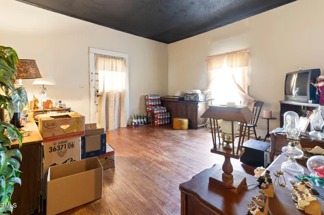 a bathroom with a toilet a sink and a window