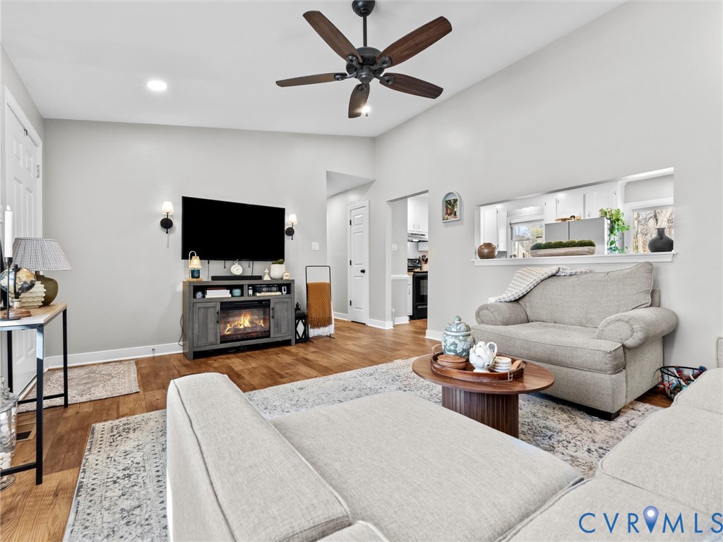 4507 Parrish Branch Road Midlothian, VA 23112 - Photo 12 of 40 a living room with furniture and a flat screen tv
