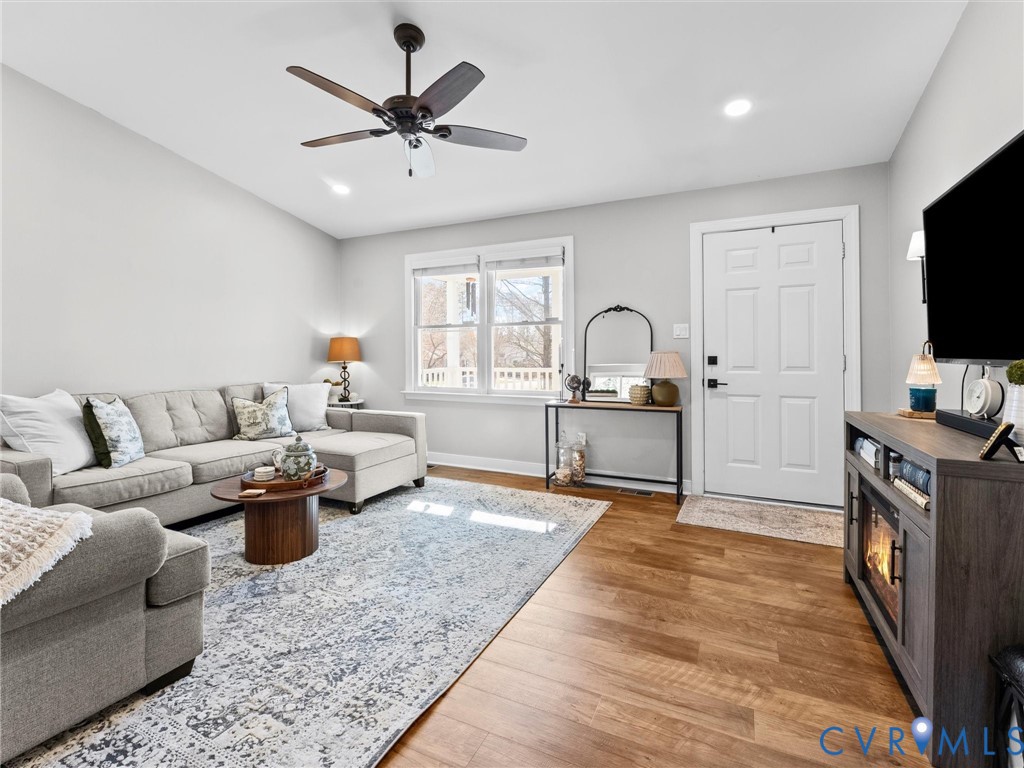 4507 Parrish Branch Road Midlothian, VA 23112 - Photo 13 of 40 a living room with furniture and a flat screen tv