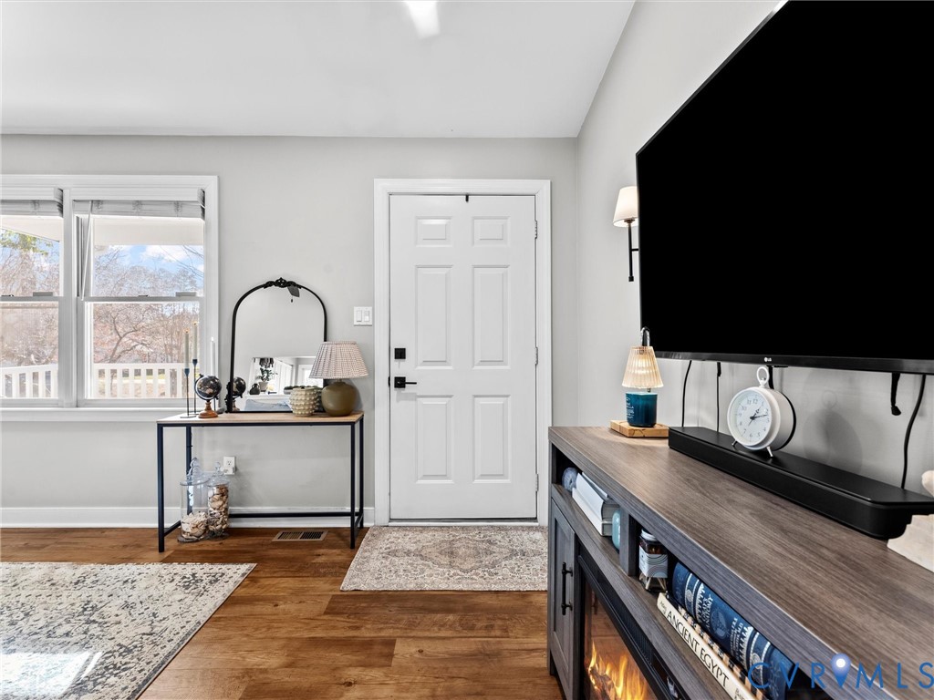 4507 Parrish Branch Road Midlothian, VA 23112 - Photo 14 of 40 a view of living room filled with furniture and flat screen tv
