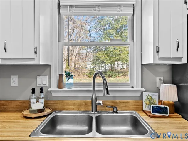 a kitchen with sink and window