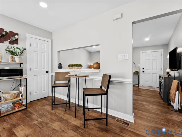 a view of a livingroom with furniture and a kitchen