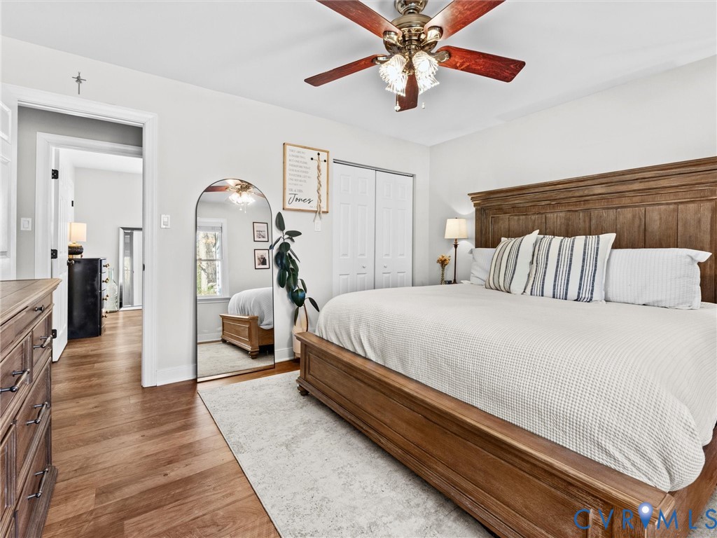 4507 Parrish Branch Road Midlothian, VA 23112 - Photo 28 of 40 a bedroom with a bed and a chandelier