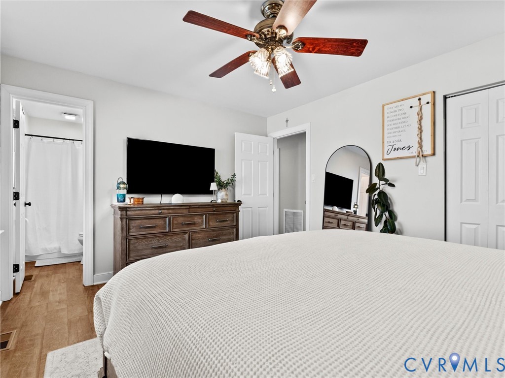 4507 Parrish Branch Road Midlothian, VA 23112 - Photo 29 of 40 a bedroom with a bed and a flat screen tv