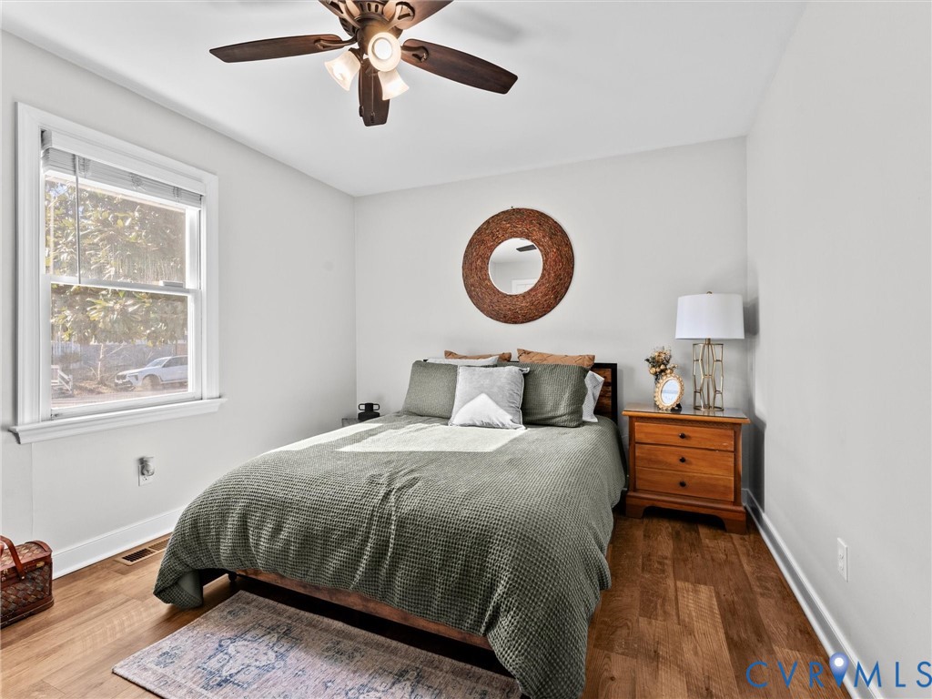 4507 Parrish Branch Road Midlothian, VA 23112 - Photo 31 of 40 a bedroom with a bed and a chandelier