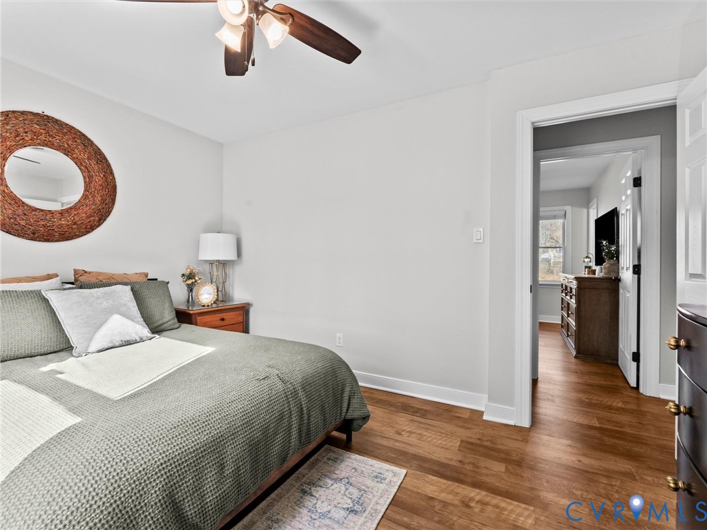 4507 Parrish Branch Road Midlothian, VA 23112 - Photo 32 of 40 a bedroom with bed and a chandelier