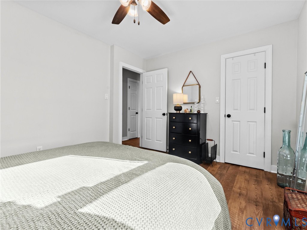 4507 Parrish Branch Road Midlothian, VA 23112 - Photo 33 of 40 a bedroom with a bed and a chandelier