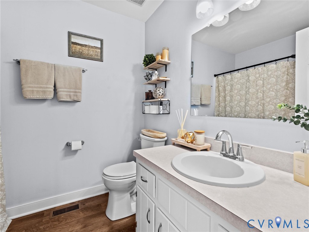 4507 Parrish Branch Road Midlothian, VA 23112 - Photo 34 of 40 a bathroom with a sink toilet and a mirror