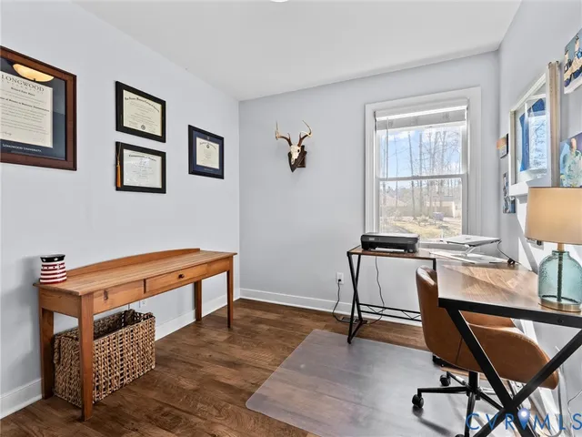 a room with furniture pool table and a window