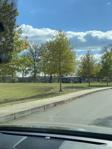 a view of swimming pool with outdoor seating and yard