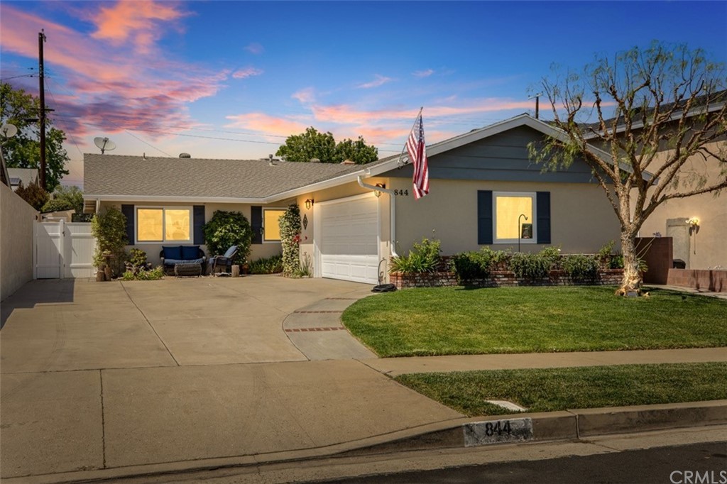 844 Eastman Place San Pedro, CA 90731 - Photo 1 of 44 a front view of a house with a garden